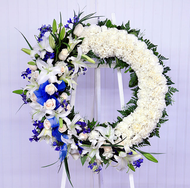 Blue & White Funeral Flower Wreath by Everyday Flowers